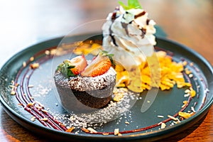 chocolate cake lava with strawberry and vanilla ice-cream