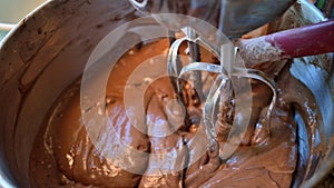 Chocolate cake mix with stand mixer and spatula, widescreen size