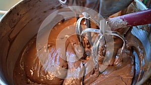 Chocolate cake mix with stand mixer and spatula, widescreen size photo