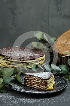 Chocolate cake napaleon, sweetness. Photograph of food on a dark background