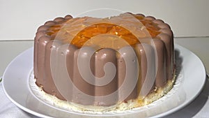 chocolate cake with orange slices in a section