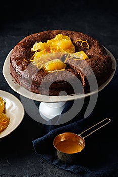 Chocolate cake with orange zest and citrus sauce. Brownie with orange.