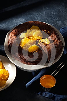 Chocolate cake with orange zest and citrus sauce. Brownie with orange.