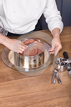 Chocolate cake preparing on kitchen table