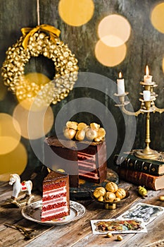 chocolate cake red velvet gold decoration rustic candles garland blur