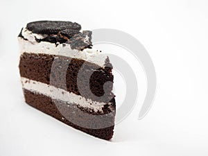 Chocolate cake slice with curl on white background