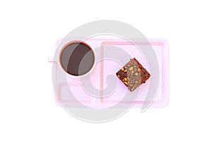 Chocolate cake Sprinkle with nuts and coffee cup in pink saucer on isolated on white background