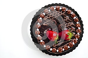 Chocolate cake with strawberries on white background