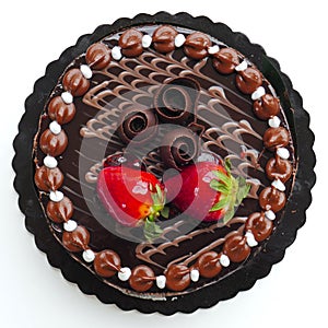 Chocolate cake with strawberries on white background