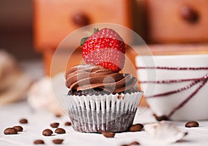 Chocolate cake with strawberries on white table