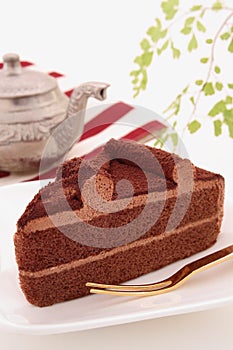 Chocolate cake with tea pot