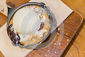 Chocolate cake with vanilla ice cream .