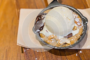 Chocolate cake with vanilla ice cream .