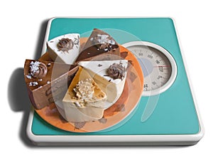 Chocolate cake on weigh-scale photo