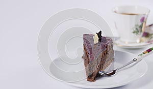 Chocolate cake on white plate