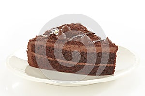 Chocolate cake on white plate