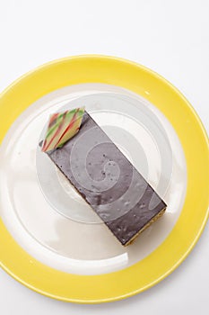 Chocolate cake on white plate