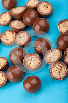 Chocolate candy balls and halves with crisp filling