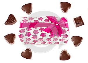 Chocolate candy and a box of chocolates in gift wrapping isolated on white. There is free space for text. Collage