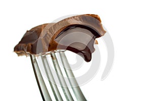 Chocolate candy on fork