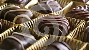 Chocolate candy rotaiting on plate