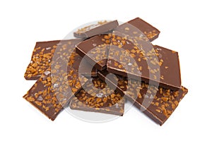 Chocolate with caramel and salt pieces isolated on white