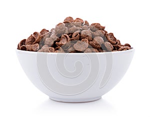 Chocolate cereals in white bowl on white background. Cornflakes
