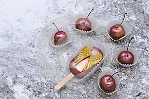 Chocolate Cherry. Cake pop with chocolate decorative golden wings