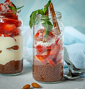 Chocolate chia pudding with yogurt and strawberries.