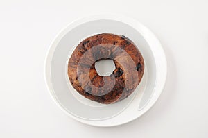 Chocolate chip bagel bread  on plate on white background