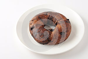 Chocolate chip bagel bread  on plate on white background