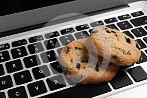 Chocolate chip cookies on laptop, closeup view