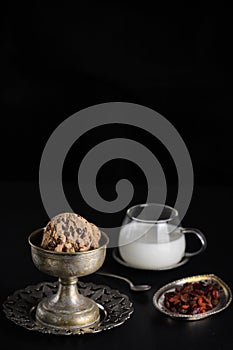 Chocolate Chip Cookies and milk on dark