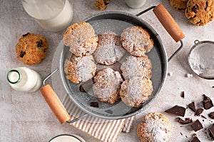 Chocolate chip cookies with milk on white background