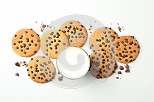 Chocolate chip cookies and milk on white background top view