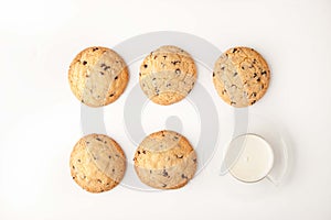 Chocolate chip cookies with milk on the white background top view