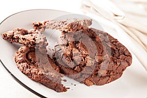 Chocolate Chip Cookies on Plate being Eaten