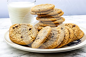 Chocolate chip cookies on a plate with milk. Calgary Alberta Canada