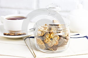 The chocolate chip cookies with poppy seeds in glass jar