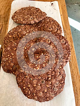 Chocolate Chip Cookies for Sale on Paper with Wooden Surface