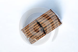 Chocolate chip cookies in a stack on a white background close-up