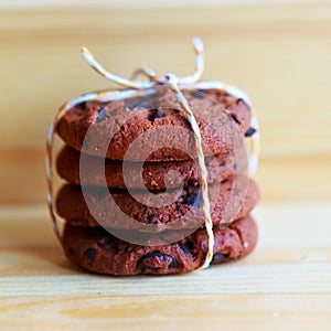 Chocolate chip cookies stack on wooden background
