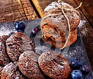 Chocolate chip cookies tied with string. Serving food on slate