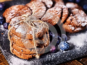 Chocolate chip cookies tied with string. Serving food on slate