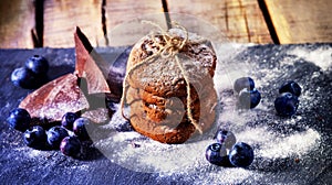 Chocolate chip cookies tied with string. Serving food on slate