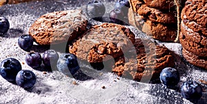 Chocolate chip cookies tied with string. Serving food on slate