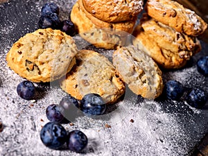 Chocolate chip cookies tied with string. Serving food on slate