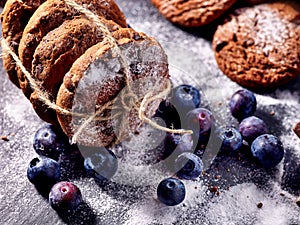 Chocolate chip cookies tied with string. Serving food on slate