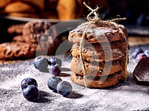 Chocolate chip cookies tied with string on shop window display