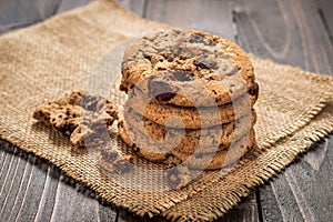 Chocolate chip cookies with wooden background